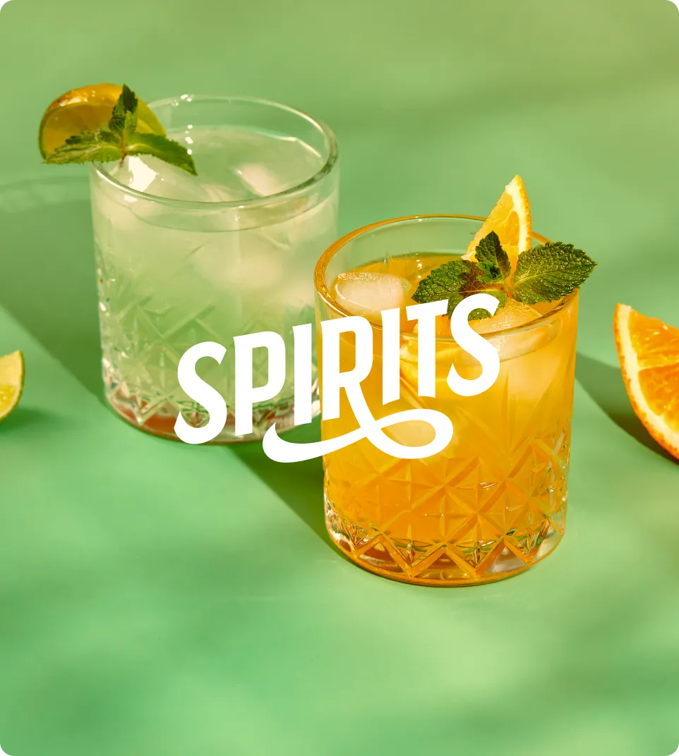 A shotglass in a person's hand